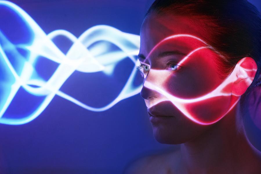 Woman with lights on face #1 Photograph by Ian Hooton/science Photo Library
