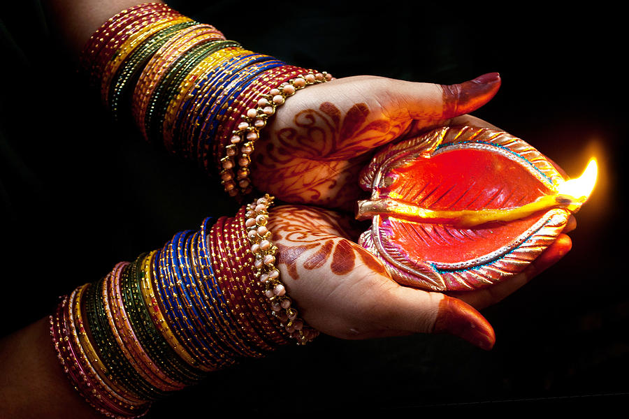 Woman with lit earthen lamp at Diwali festival #1 Photograph by Subir Basak