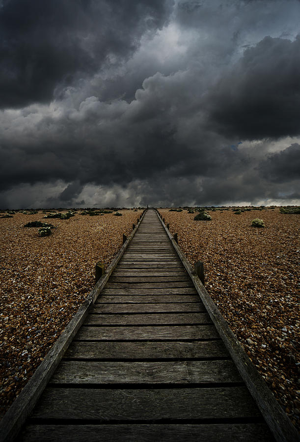 Wooden path in the wilderness. Dramatic sky in the background Photograph by Jaroslaw Blaminsky
