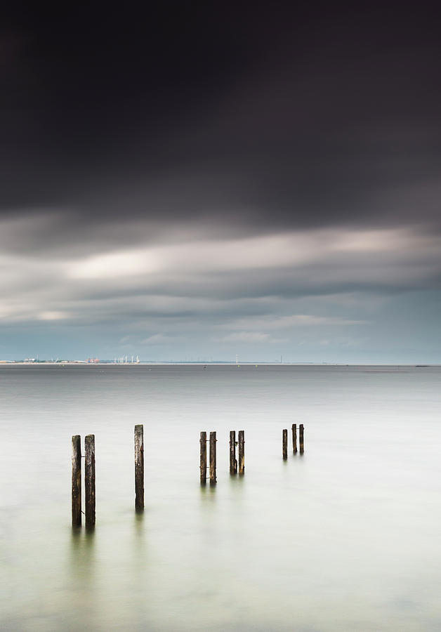 Wooden Posts In A Row In The Shallow #1 Photograph by John Short / Design Pics