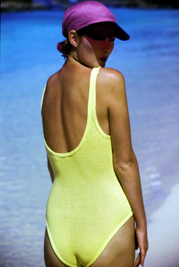 Yasmine Sokal Wearing A Yellow Swimsuit Photograph by Arthur Elgort