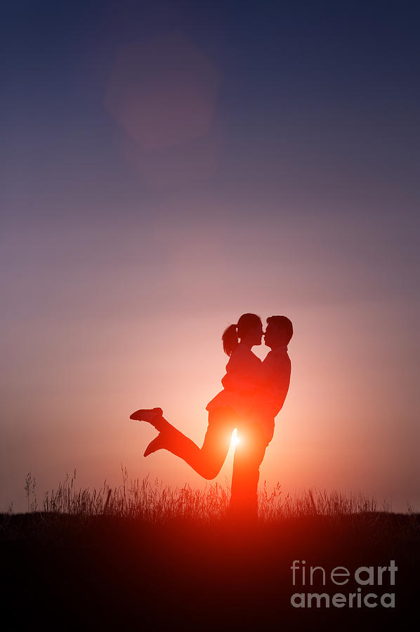 Young Lovers Embracing At Sunset #1 Photograph by Lee Avison
