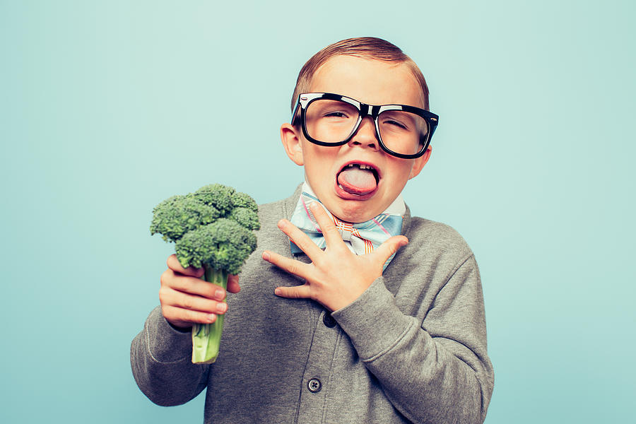 Young Nerd Boy Hates Eating Broccoli #1 Photograph by RichVintage