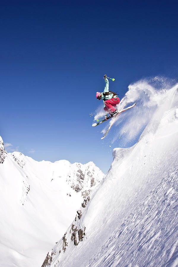 Young Woman Catches Air While Skiing #1 Photograph by Henry Georgi Young Woman Catches Air While Skiing #1 Photograph by Henry Georgi