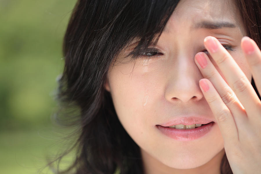 Young woman crying, close-up #1 Photograph by Eriko Koga