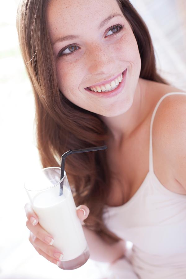 https://images.fineartamerica.com/images-medium-large-5/1-young-woman-drinking-milk-ian-hootonscience-photo-library.jpg