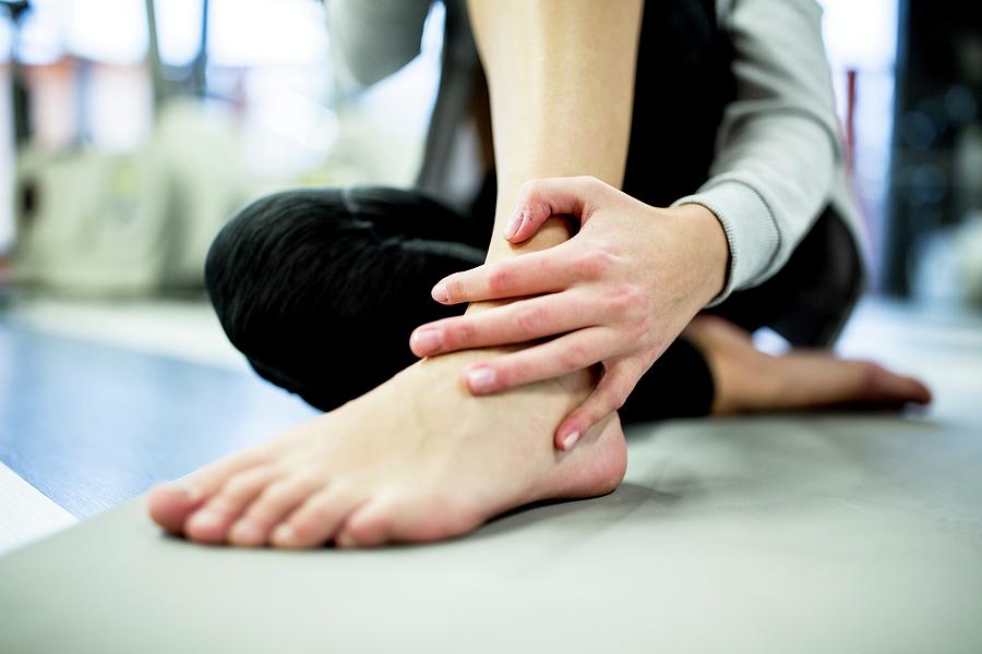 Young Woman Having Ankle Pain #1 Photograph by Science Photo Library