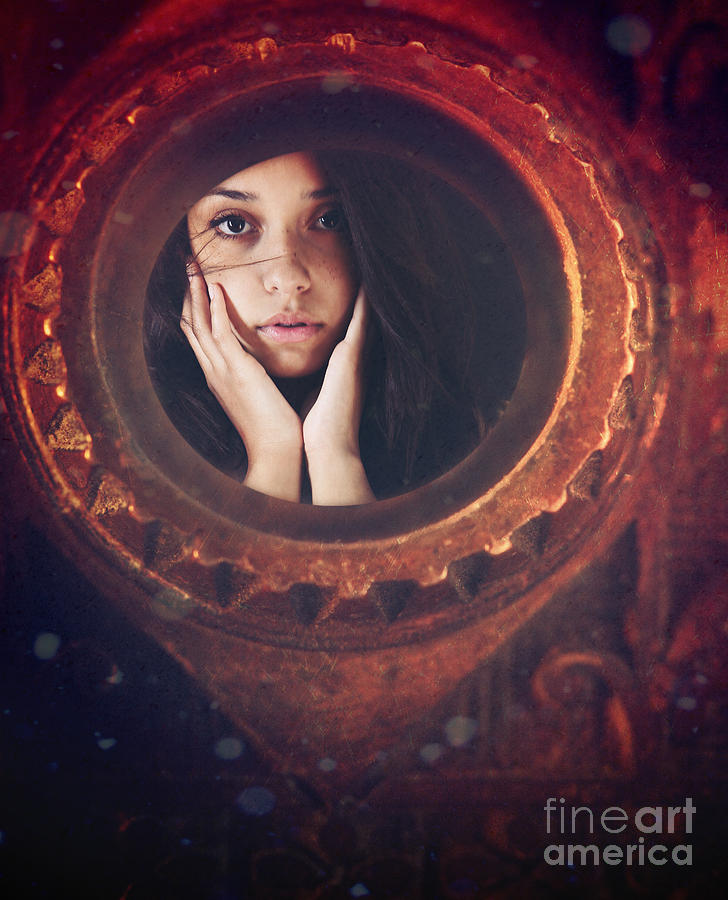 Young woman looking unsure and afraid looking through peep hole  #1 Photograph by Sandra Cunningham