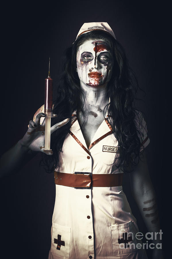 Halloween Photograph - Zombie nurse holding bloody euthanasia syringe #1 by Jorgo Photography