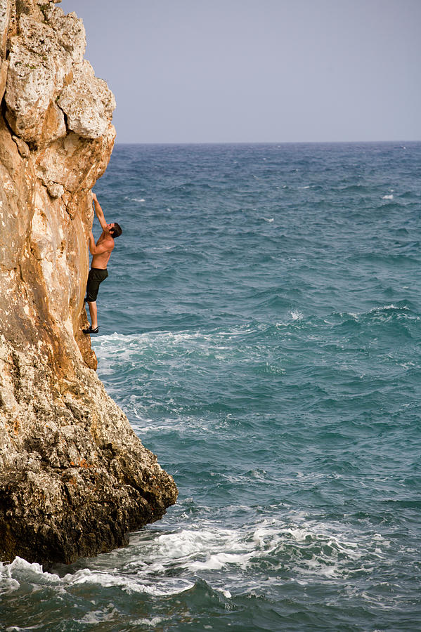 A Man Rock Climbing Deep Water Soloing Photograph By Corey Rich Fine Art America