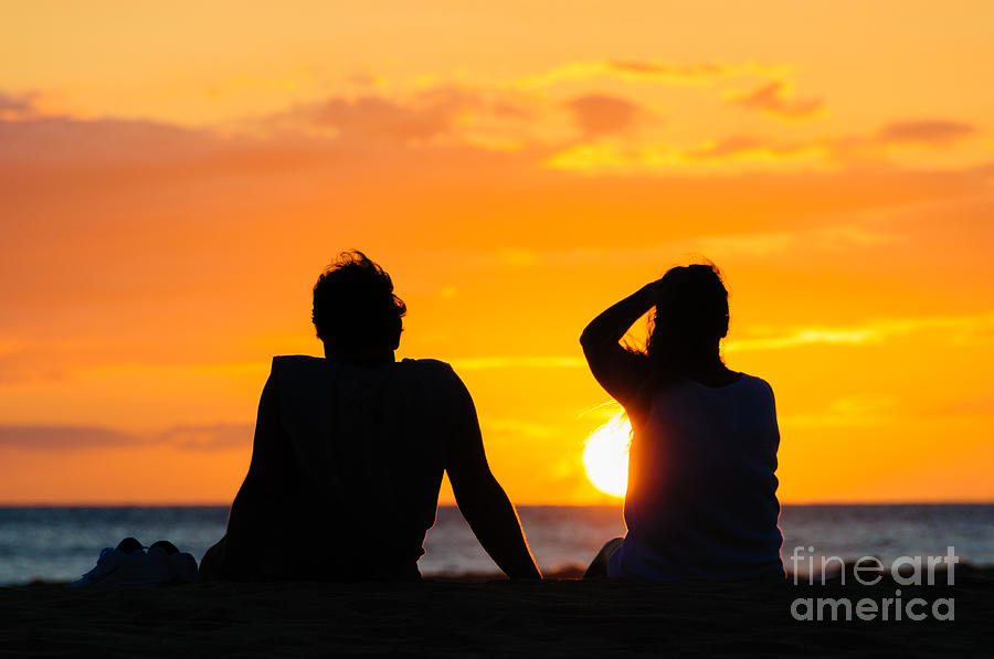 Couple watching the sunset on a beach in Maui Hawaii USA #10 Photograph by Don Landwehrle