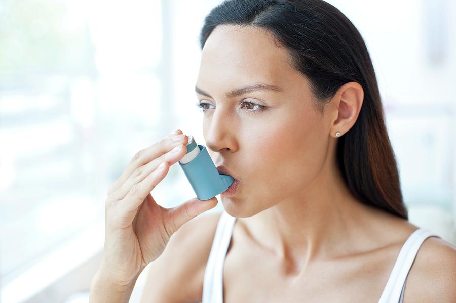 Young Woman Using Inhaler Photograph by Science Photo Library - Pixels