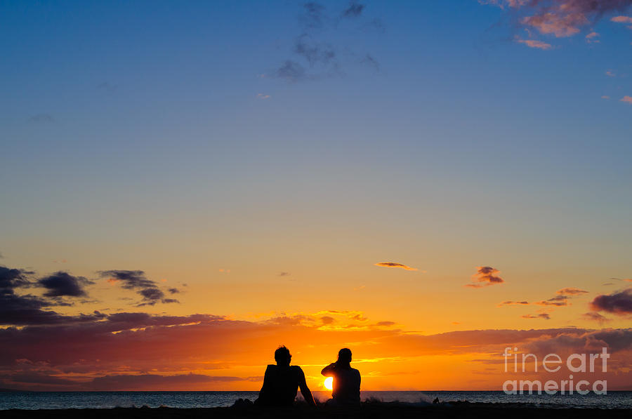Couple watching the sunset on a beach in Maui Hawaii USA #11 Photograph by Don Landwehrle