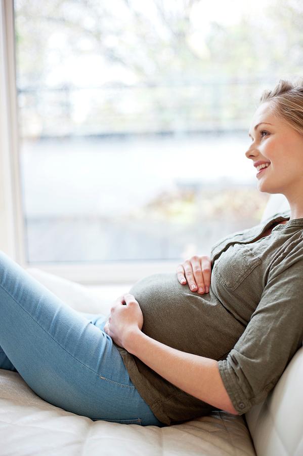 Pregnant Woman Touching Tummy Photograph By Ian Hooton Science Photo