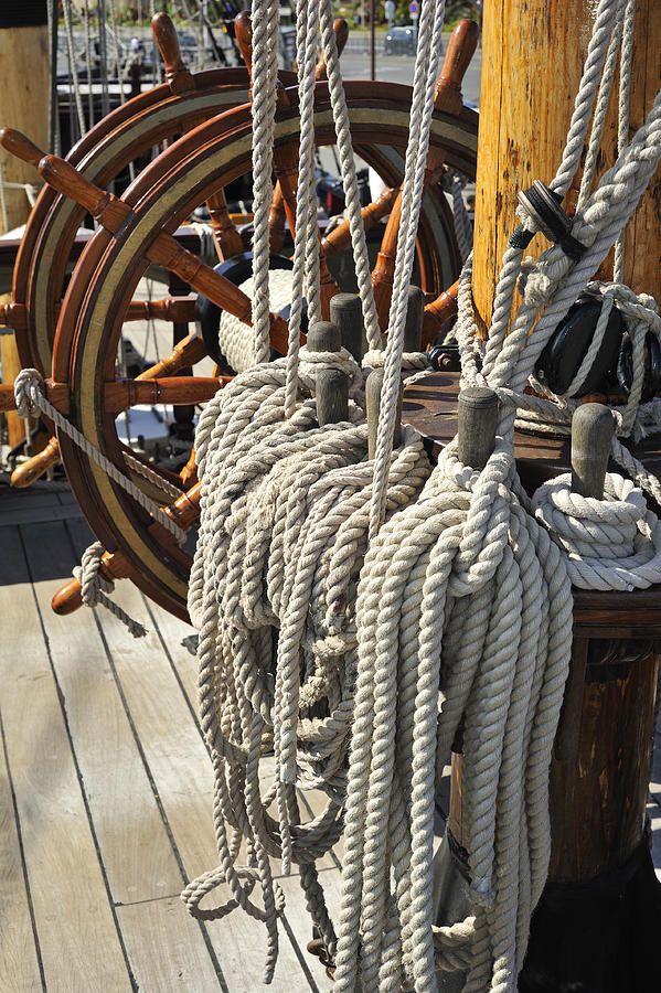 Steering Wheel and Coiled Ropes Photograph by Arterra Picture Library