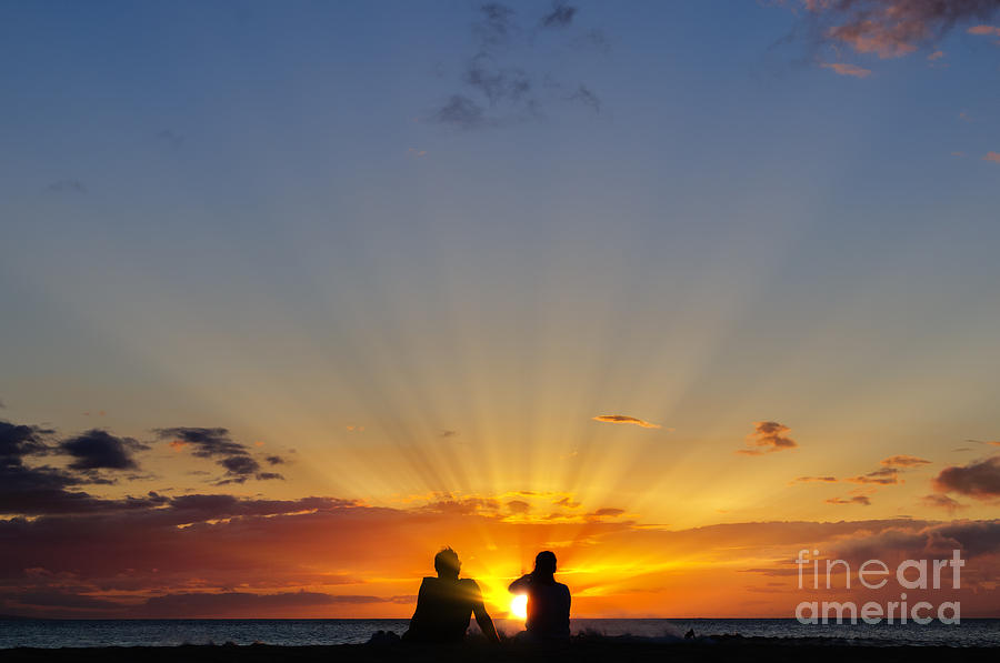 Couple watching the sunset on a beach in Maui Hawaii USA #12 Photograph by Don Landwehrle
