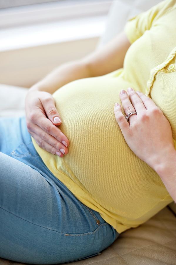 Pregnant Woman Touching Tummy Photograph By Ian Hooton Science Photo