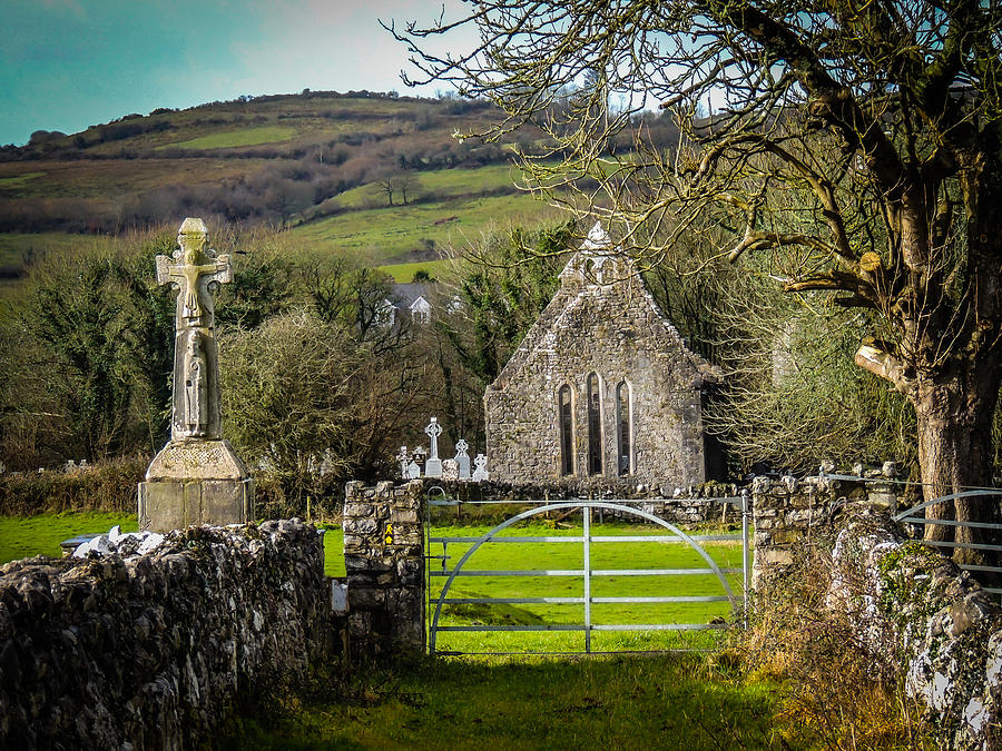 12th Century Cross and Church in Ireland Photograph by James Truett