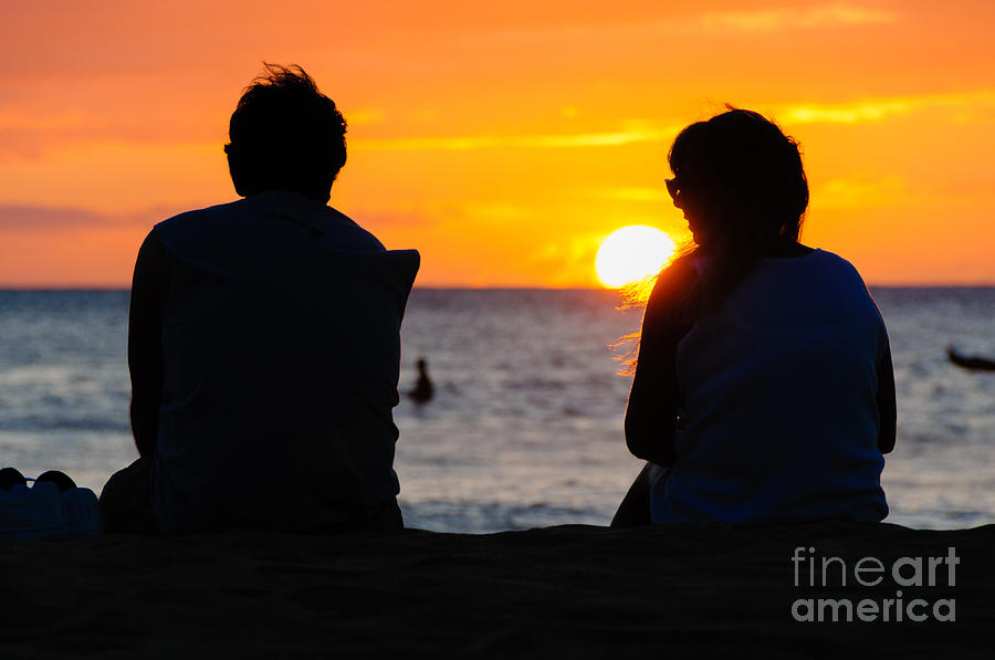 Couple watching the sunset on a beach in Maui Hawaii USA #13 Photograph by Don Landwehrle