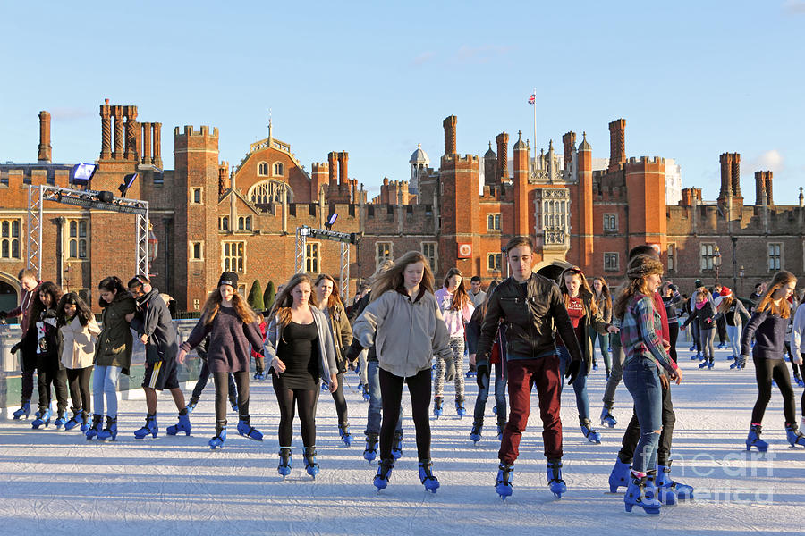 Ice skating at Hampton Court Palace ice rink England UK #13 Photograph by Julia Gavin