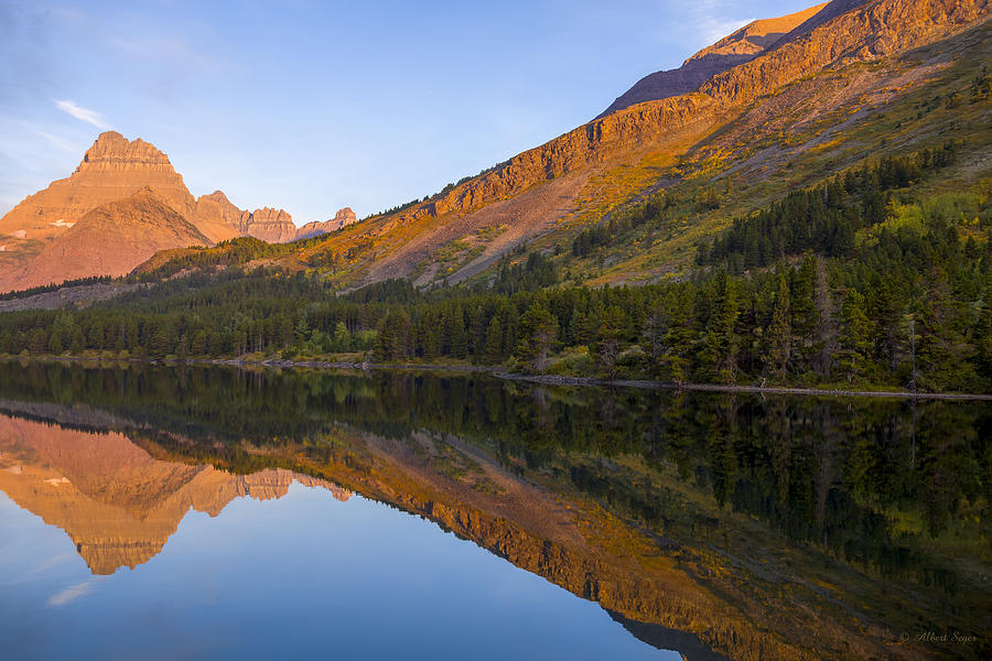 140917A-062 Mountains reflected in Swiftcurrent Lake Photograph by Albert Seger