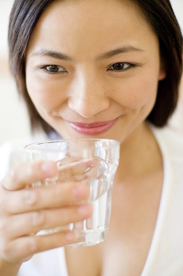 Drink Photograph - Woman Drinking Water #15 by Ian Hooton/science Photo Library