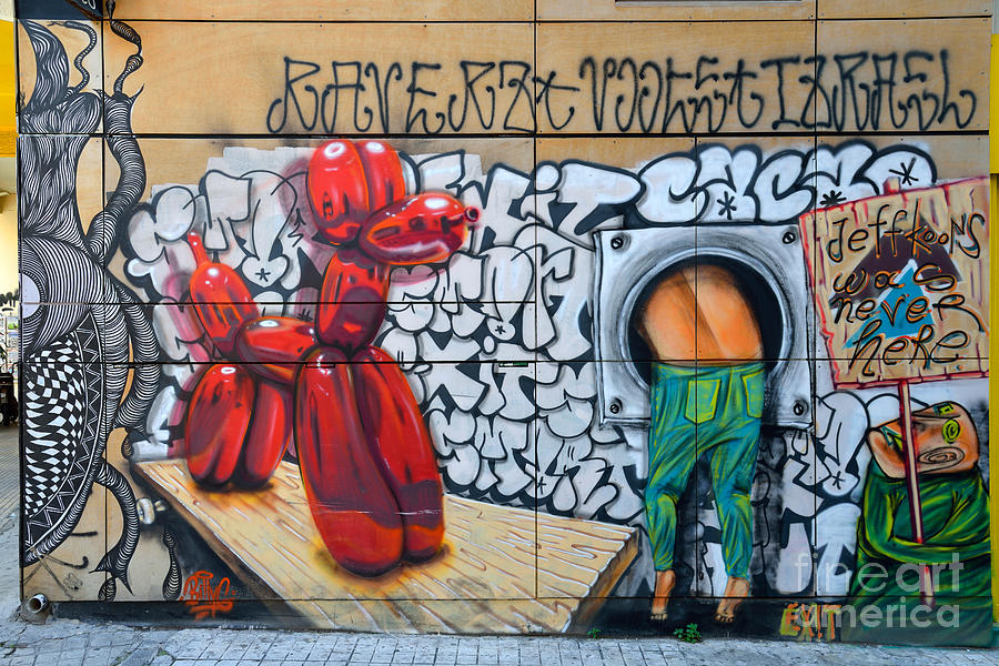 Graffiti on a wall #22 Photograph by George Atsametakis