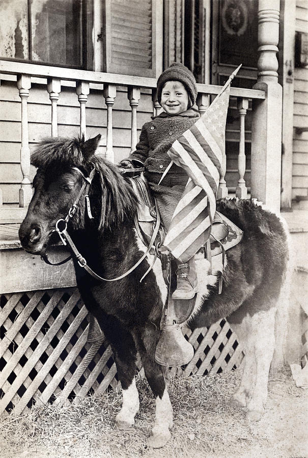 1920 Patriotic Boy riding Pony Photograph by Historic Image
