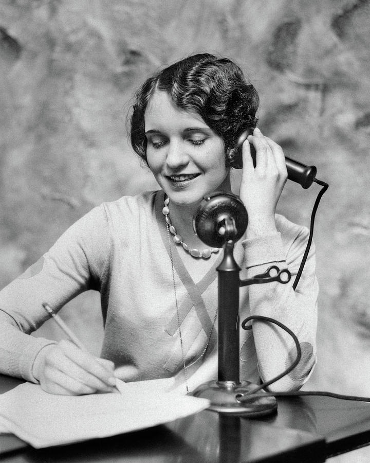 1920s Smiling Woman Sitting At Desk Photograph by Vintage Images - Fine ...