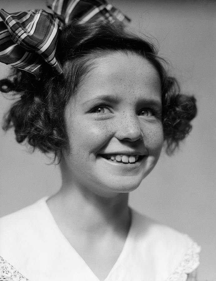 Black And White Photograph - 1930s Freckle Faced Smiling Girl by Vintage Images