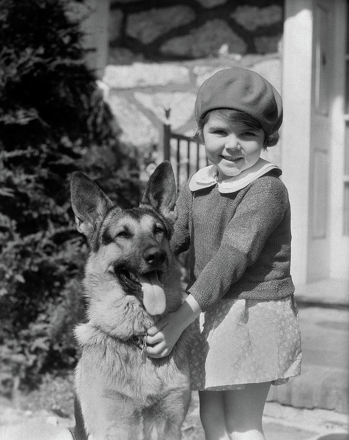 Black And White Photograph - 1930s Little Girl Standing Holding by Animal Images