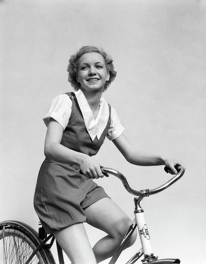 Black And White Photograph - 1930s Smiling Blonde Woman Riding by Vintage Images