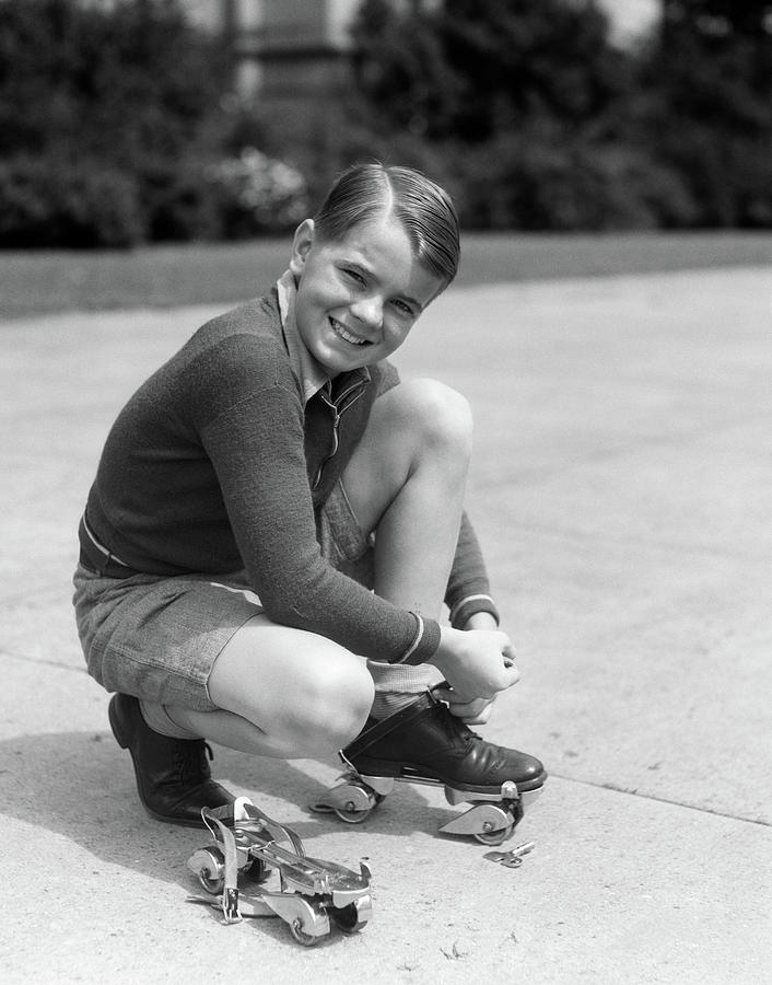 1930s Smiling Boy Fastening Photograph by Vintage Images - Pixels