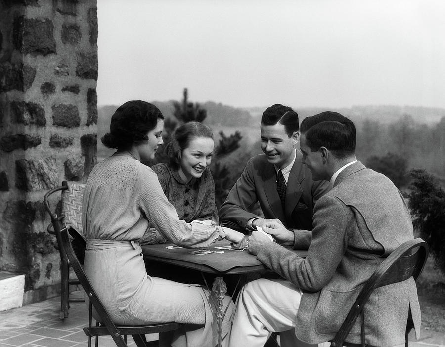 Black And White Photograph - 1930s Two Couples Playing Cards by Vintage Images