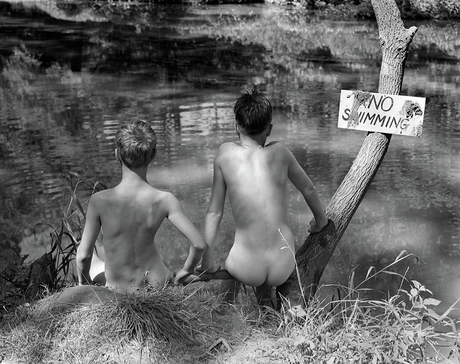 Black And White Photograph - 1940s 1930s Two Boys Near Lake Under No by Vintage Images