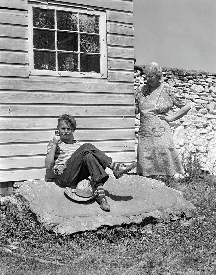 1940s Farm Boy Leaning Against Building Photograph by Vintage Images ...