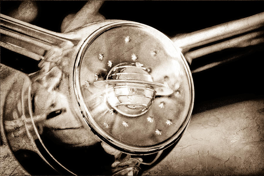 1950 Oldsmobile Steering Wheel Emblem Photograph by Jill Reger