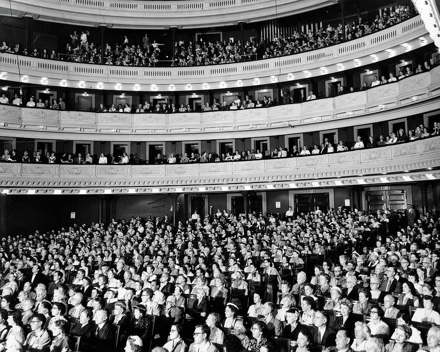 Black And White Photograph - 1950s Audience Sitting In Carnegie Hall by Vintage Images