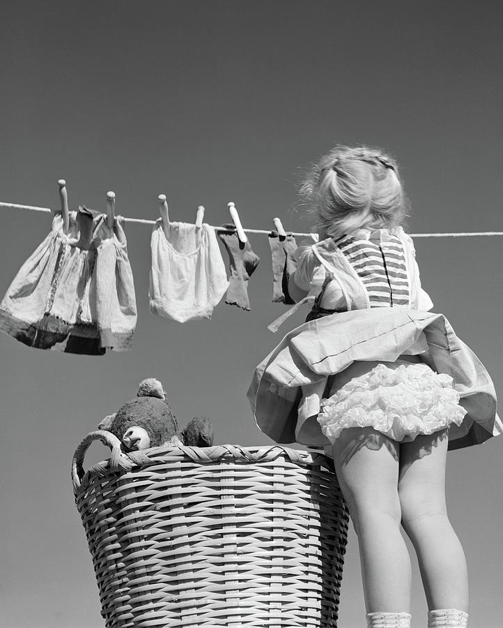 1950s Back View Of Girl Hanging Laundry Photograph by Vintage Images