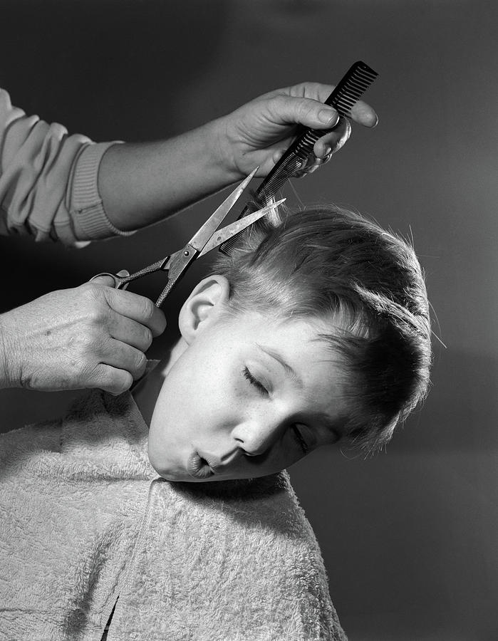 1950s Boy Making Face As Adult Cuts Photograph by Vintage Images 1950s Boy Making Face As Adult Cuts Photograph by Vintage Images