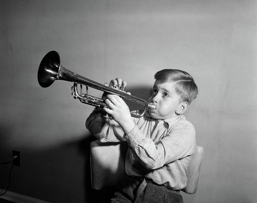 1950s Boy Playing Trumpet Horn by Vintage Images