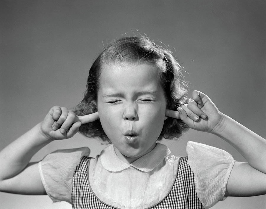 1950s-girl-with-fingers-in-ears-eyes-vintage-images.jpg