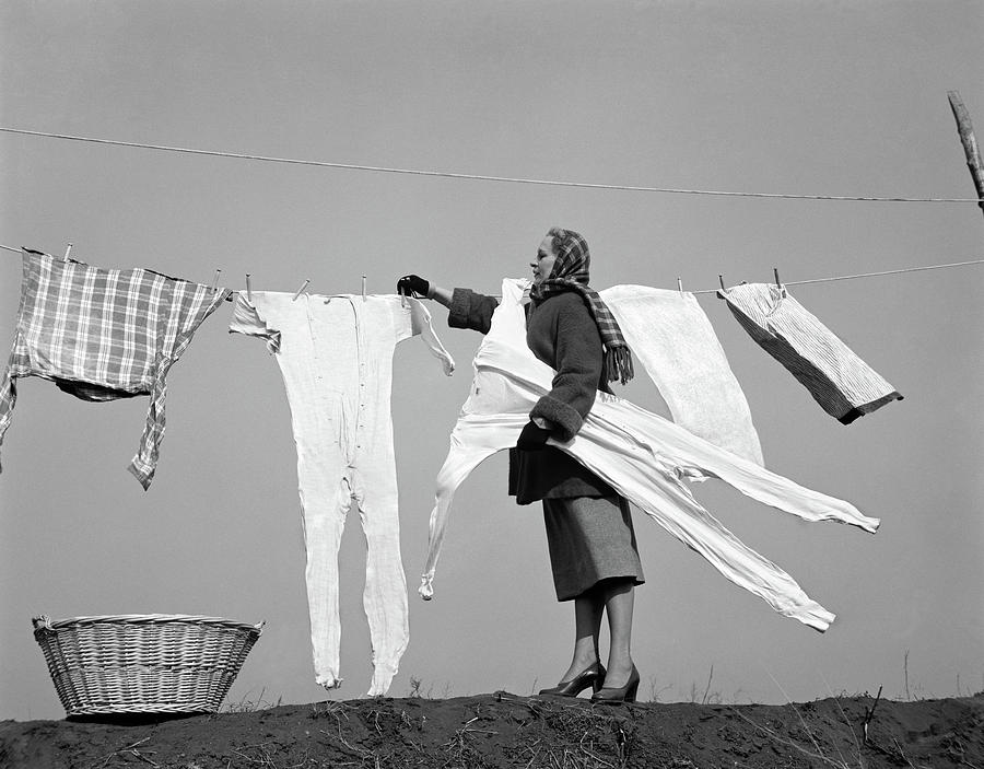 1950s Housewife Removing Frozen Long Photograph by Vintage Images