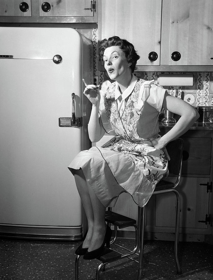 1950s Housewife Sitting On Stool Photograph by Vintage Images