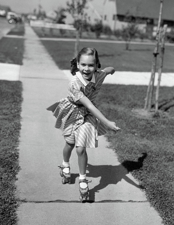 Black And White Photograph - 1950s Little Girl Roller-skating by Vintage Images