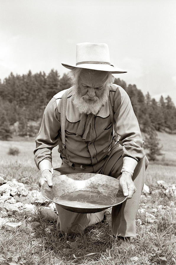 Black And White Photograph - 1950s Male Prospector Panning For Gold by Vintage Images