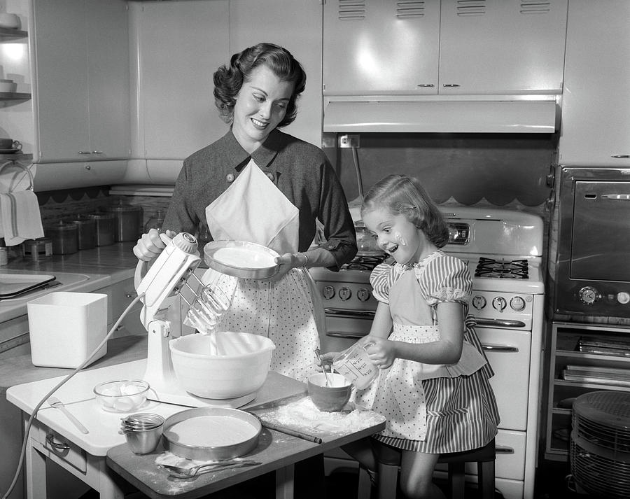 1950s Mother &amp; Daughter Baking A Cake Photograph by Vintage Images