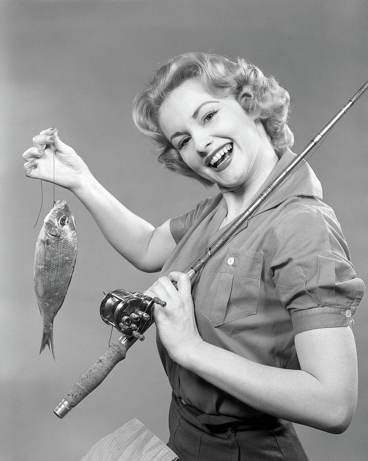 1950s Smiling Woman With A Fishing Rod by Vintage Images