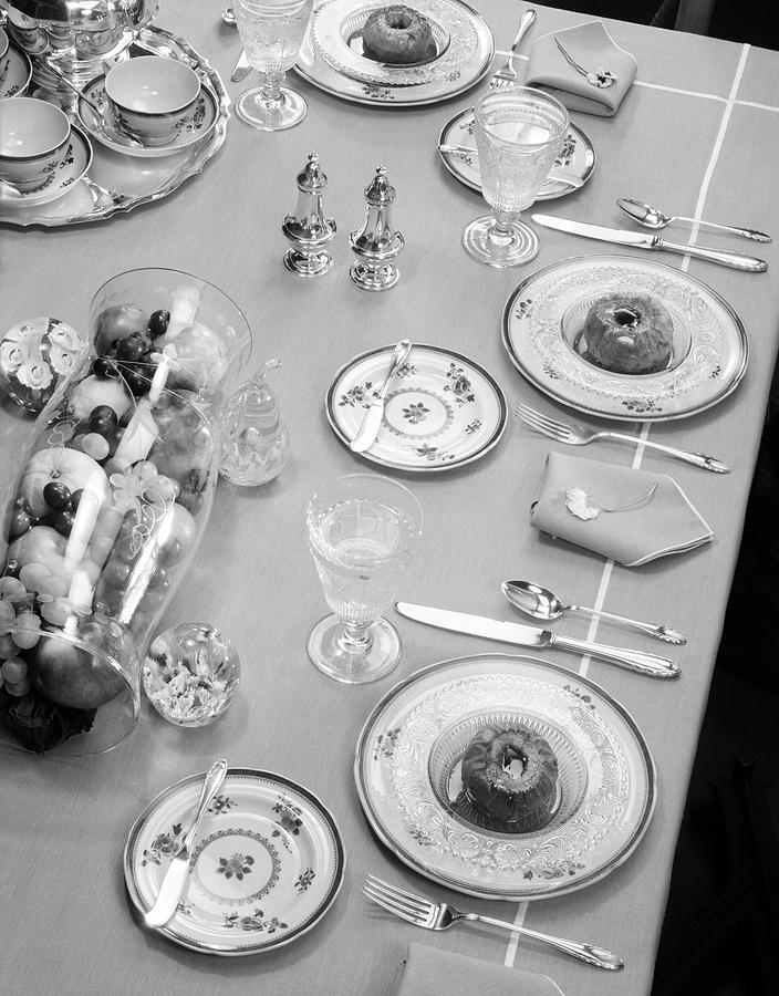 Black And White Photograph - 1950s Table Setting Centerpiece Dinner by Vintage Images