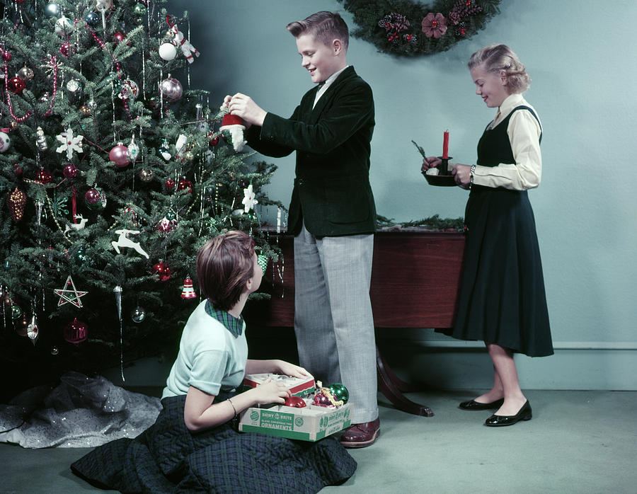 Christmas Photograph - 1950s Two Girls And One Boy Decorating by Vintage Images